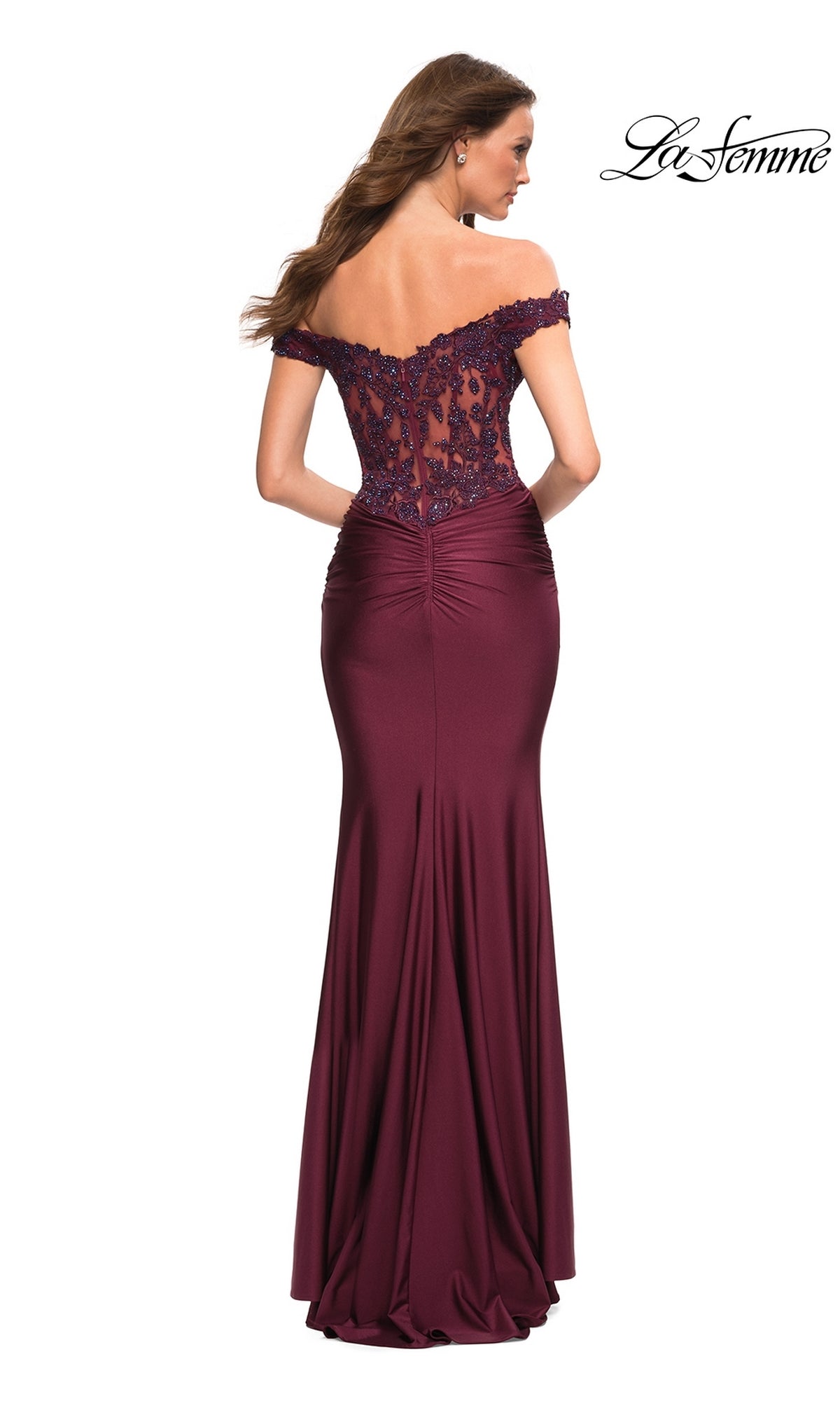 A woman models the Lace-Bodice La Femme Off-the-Shoulder Prom Dress in burgundy, featuring a sheer lace bodice and a floor-length skirt, elegantly displayed from the back.